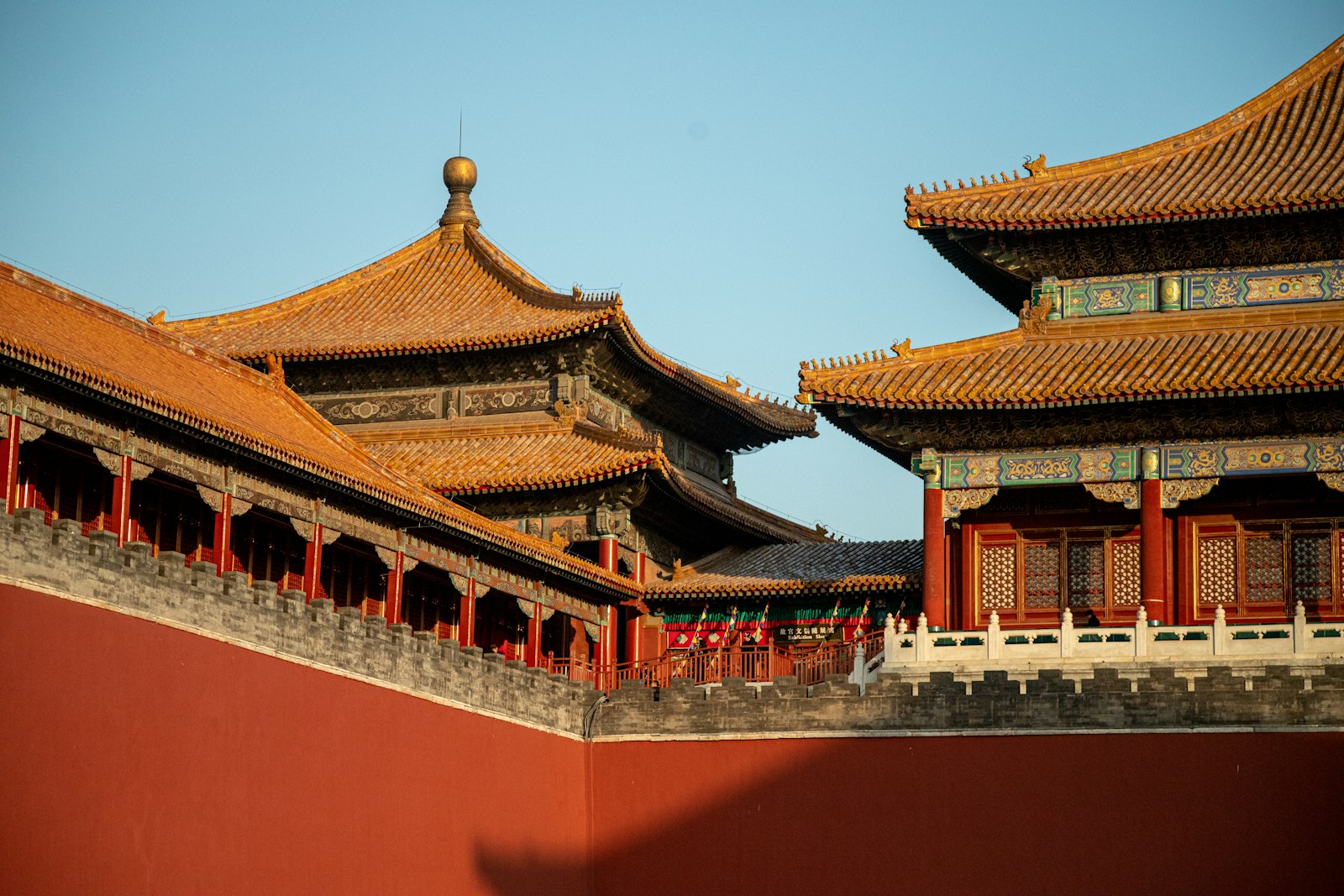 The red walls and golden roofs of the Forbidden City in Beijing