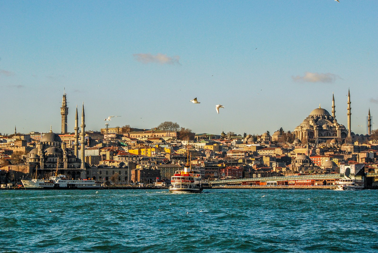 The Istanbul skyline from the water, with a ferry crossing the Golden Horn