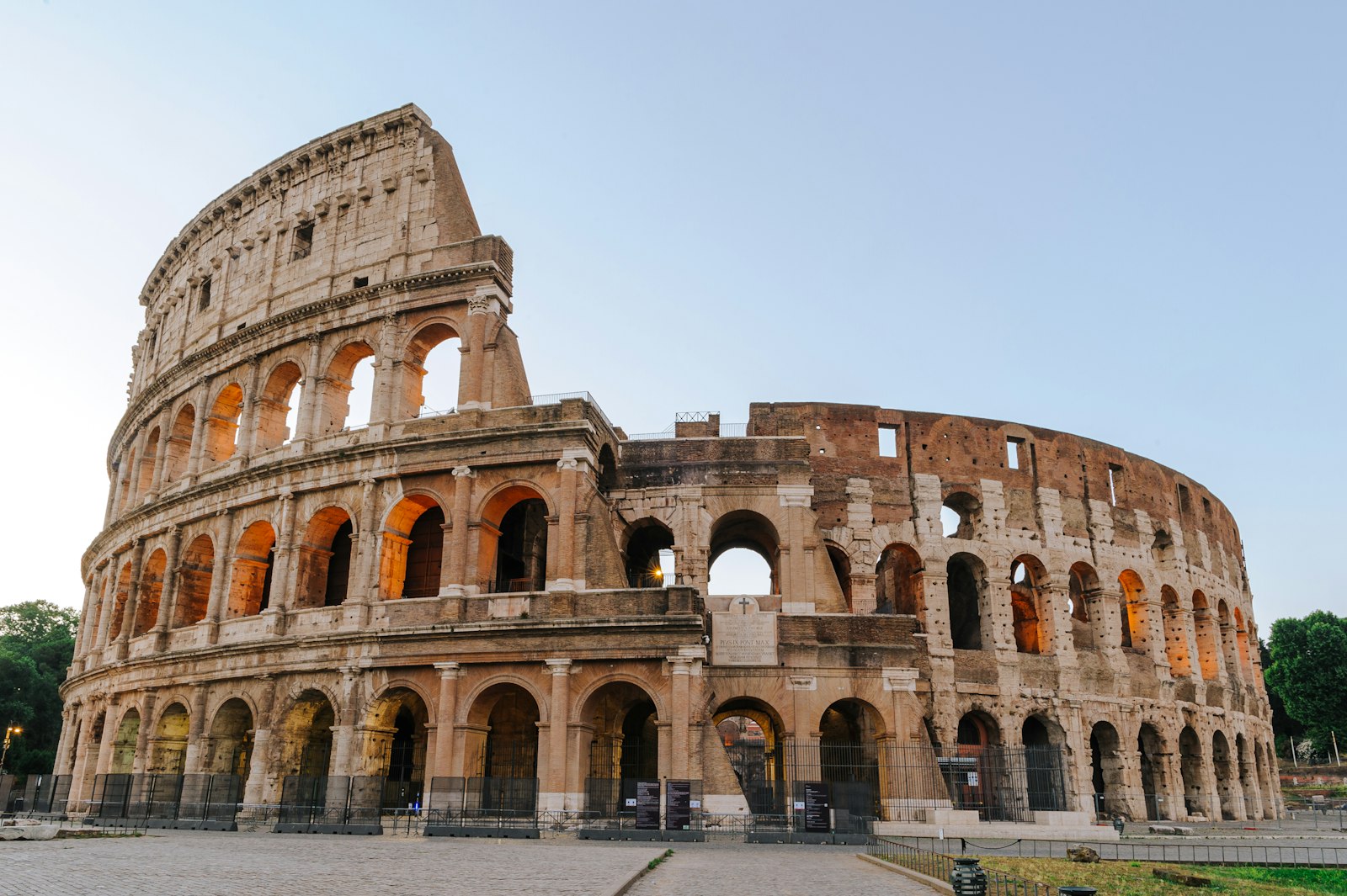 The Colosseum in Rome under a clear sky