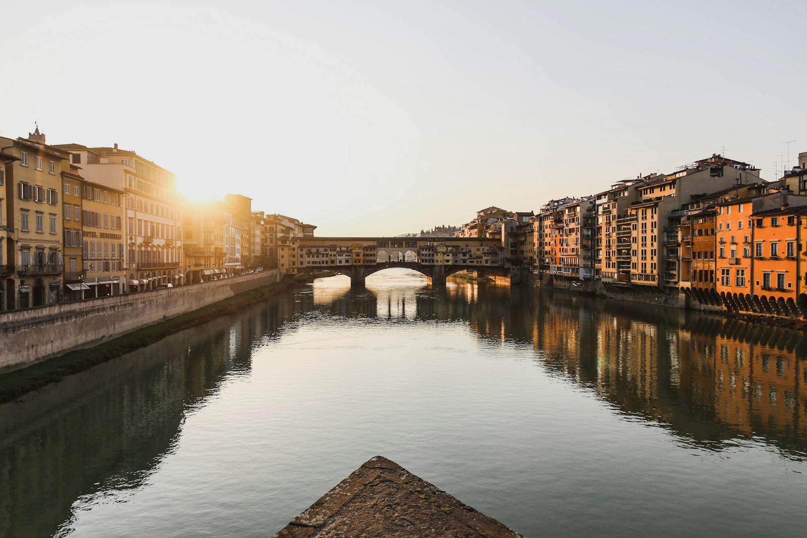 The Arno river and Ponte Vecchio in Florence at sunset