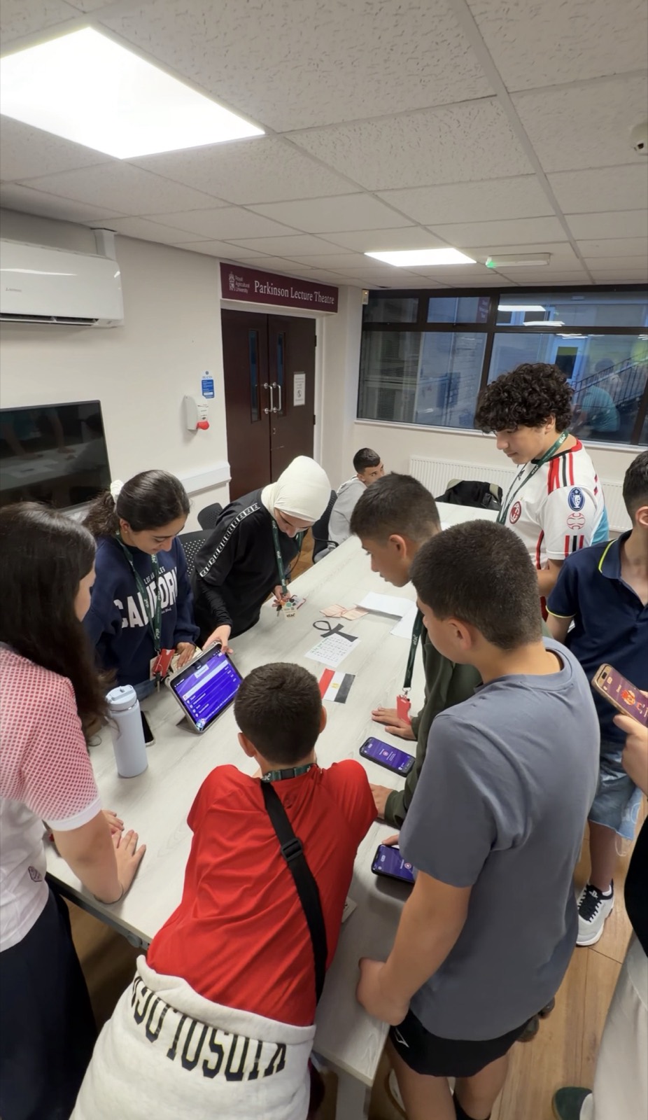 Students gathered around a table during a group task