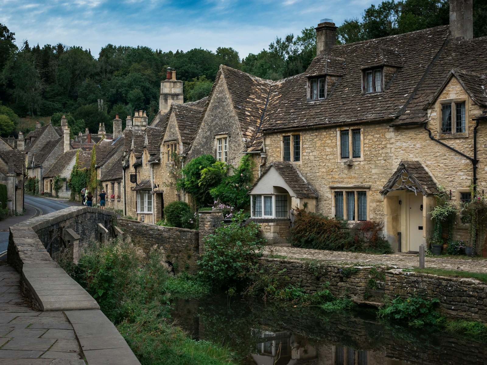 Stone cottages by a stream in the English countryside
